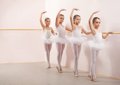 Group of six little ballerinas posing together with back to camera. They are good friend and amazing dance performers