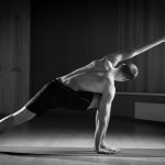 young man doing yoga in the gym